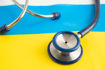 Stethoscope on Ukraine flag background, Business and finance.