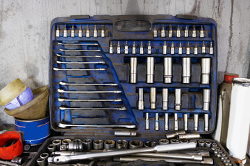 mechanical tools in a toolbox on a gray background.