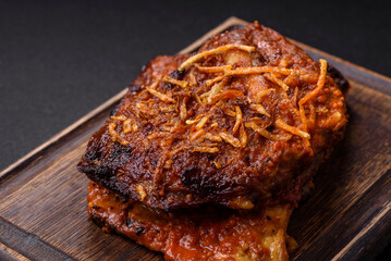 Delicious pork or beef ribs baked on the grill with salt, spices and herbs