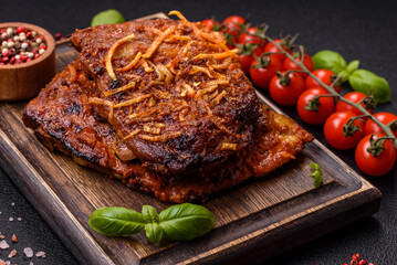 Delicious pork or beef ribs baked on the grill with salt, spices and herbs