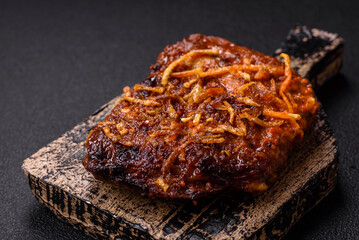 Delicious pork or beef ribs baked on the grill with salt, spices and herbs