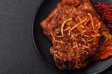 Delicious pork or beef ribs baked on the grill with salt, spices and herbs