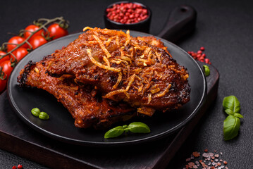 Delicious pork or beef ribs baked on the grill with salt, spices and herbs