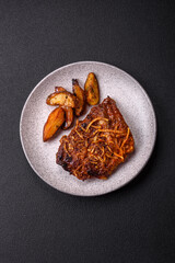 Delicious pork or beef ribs baked on the grill with salt, spices and herbs