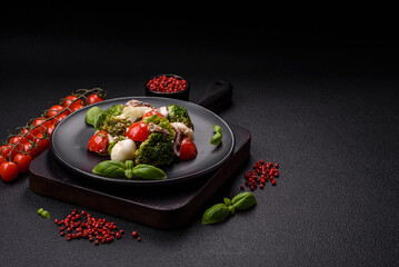 Delicious fresh juicy salad with quail eggs, cherry tomatoes, lettuce leaves