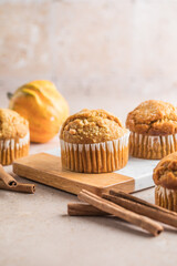 Autumn pumpkin cupcakes or  baked muffins with fresh pumpkin for Thanksgiving day.