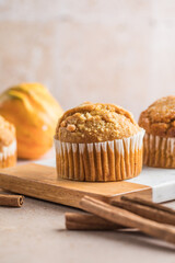 Autumn pumpkin cupcakes or  baked muffins with fresh pumpkin for Thanksgiving day.