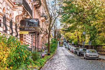 Lviv, Ukraine - November 2, 2023: Parked cars and public transport on Solomii Krushelnytskoi Street in Lviv. Traffic on the historic street near Ivan Franko Park on an autumn day