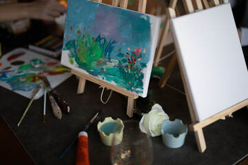 artist easel with brushes