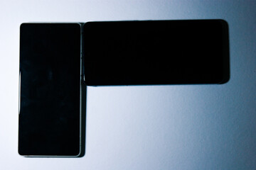 modern technology with two smartphones on a white background, gadgets and technology