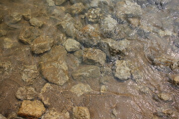 rocks and stones in shallow water