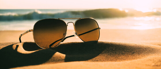 Sunglasses in summer beach sand, travel, tourism, recreation, copy space area