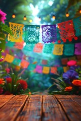 Fototapeta premium String of handmade cut paper flags on blurred background with empty wooden stage. Mexican party decoration. Day of the Dead, Halloween, Cinco de Mayo. Template with space for text, design or product
