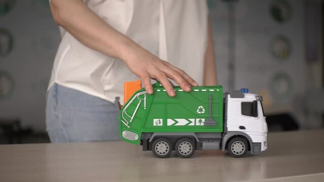 woman and garbage truck.. garbage truck. recycled products. slow motion video. High-quality 4K shooting