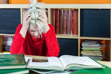 Stressed student overwhelmed by studies.