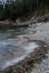 Stone strewn ocean shoreline on the coast of Maine