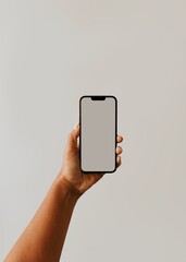 Person taking a photo with phone camera with blank photo screen and blank white wall