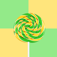 Sweet and delicious green and yellow swirl spiral lollipop candy.