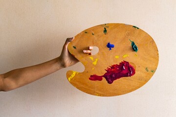 Woman artist carrying her color palette