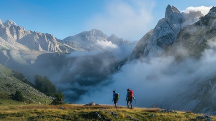 Fototapeta premium Hikers Exploring Majestic Mountain Landscape at Sunrise