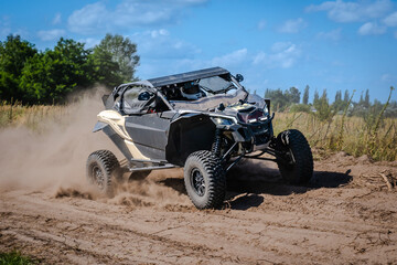Fototapeta premium ATV and UTV riding in sandy dusty track. Amateur competitions. 4x4.