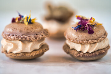 Close-Up of Macarons with Cream and Flowers