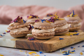 Gourmet Macarons with Cream and Edible Flowers