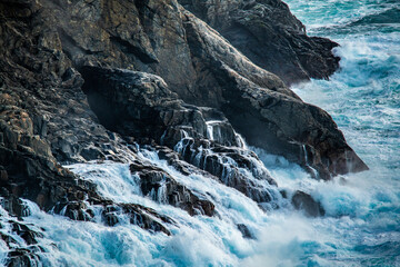 Cliffs with big waves breaking at the coast.