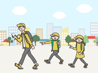 街中でデジタルスタンプラリーに参加する家族