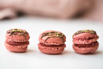  Three Pink Macarons with Chocolate Cream
