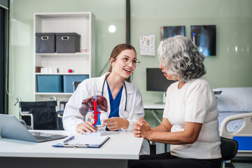Caucasian woman accompanies an elderly Asian woman dealing with Hepatitis B, cirrhosis, and liver cancer. They seek medical advice and support together. Liver model learning