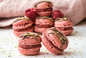 Pink Macarons with Chocolate Drizzle and Pistachios