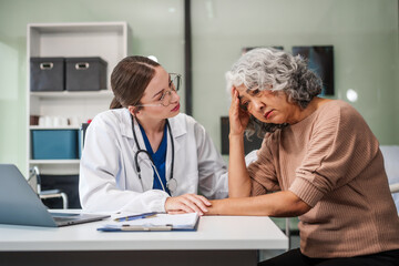 Caucasian female psychiatrist sits at her desk, providing mental health consultations and therapy...