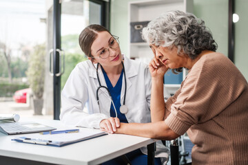 Caucasian female psychiatrist sits at her desk, providing mental health consultations and therapy...