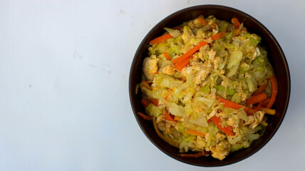 scrambled eggs with carrots and cabbage in a bowl or orak arik 