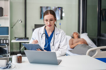 Caucasian female psychiatrist sits at her desk, providing mental health consultations and therapy...