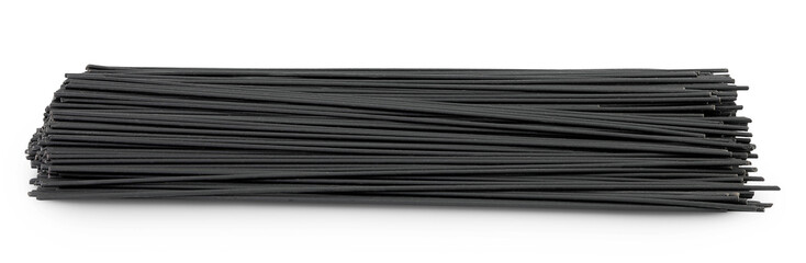 uncooked black spaghetti isolated on white background