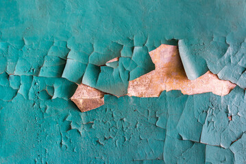 Texture Of An Old Yellow Concrete Wall With Cracked Turquoise Paint