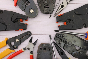 Electrical installation tools for work on the assembly of electrical equipment. Close-up. - obrazy, fototapety, plakaty