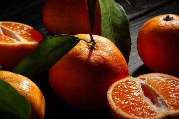 tangerine on black wood background - 801203704