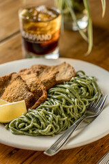 Milanese of peceto with ribbons of vegetables ready to eat