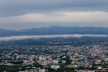 Obraz premium High-angle view of the city with mist passing through. Many buildings in Chiang Mai, Thailand