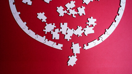 white deconstructed puzzles on a colored background
