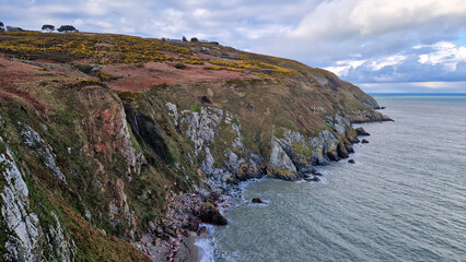 Fototapeta na wymiar As the trail winds higher, Dublin Bay unveils its majestic beauty, a sight that rewards the intrepid hiker with a panorama of coastal splendor from the heights of Howth. 