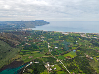 Aerial top view by drone of cretan landscape with sea. - obrazy, fototapety, plakaty