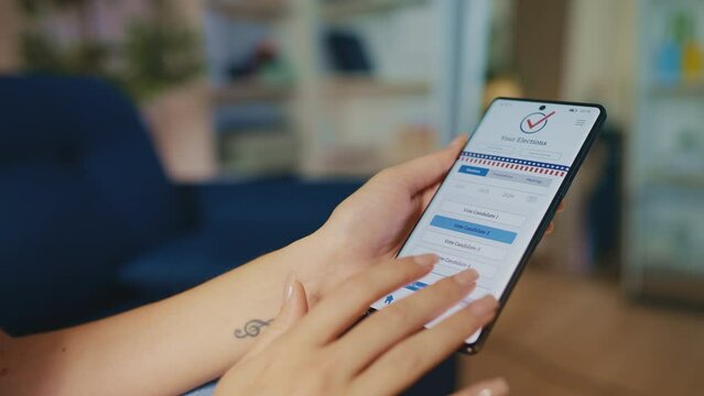 Young woman voting online on smartphone, casting a vote in a state election app