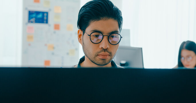 Group Adult Asia male, female freelance typing write prompt AI bot IT app smart program nomad, video game, terminal with coding language, user interface, designer, big data center on desktop computer.