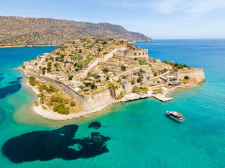 Aerial drone view of Spinalonga island with calm sea. Old venetian fortress island and former leper...