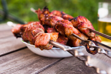 Top view of tasty shish kebab from pork on plate