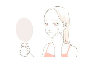 肌の悩みで鏡を見ている女性